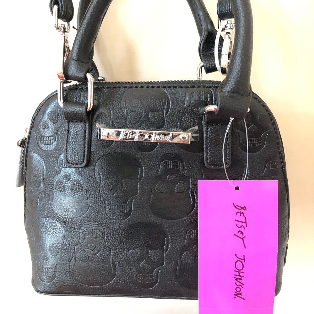 Black Skulls Betsey Johnson hand bag with a strap